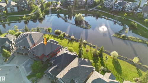 Aerial perspective showcasing a residential property with a multi-story design and a dark shingle roof - 3438 West Landing Landing, Edmonton, AB 