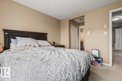 Carpeted sleeping area with neutral wall tones - 