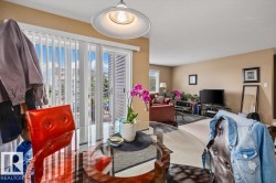 Dining area with a glass-top table, overhead pendant lighting, and direct access to an outdoor space via a sliding glass door - 