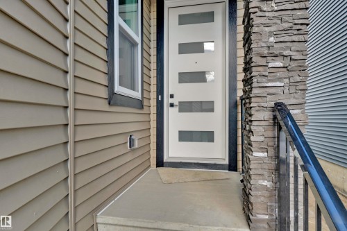 Contemporary entry door with frosted glass inserts - 4409 35 Street, Beaumont, AB - Outdoor