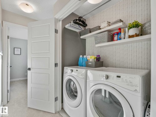 Laundry area featuring built-in shelving, - 162 Kirpatrick Way, Leduc, AB 