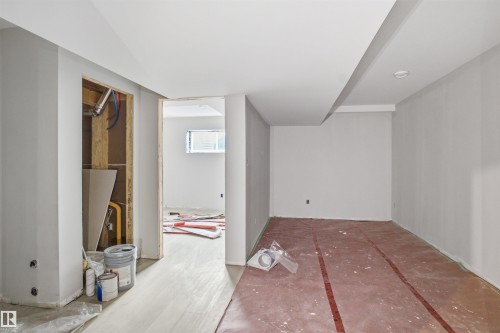Open concept interior space with recessed lighting and a window providing natural illumination - 1222 Podersky Wynd, Edmonton, AB 