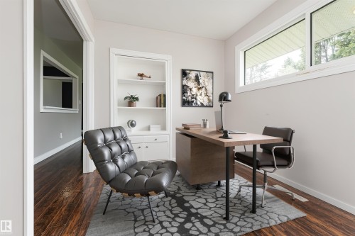 Dedicated office space featuring a built-in white bookshelf with lower cabinetry - 13411 140 Street, Edmonton, AB 