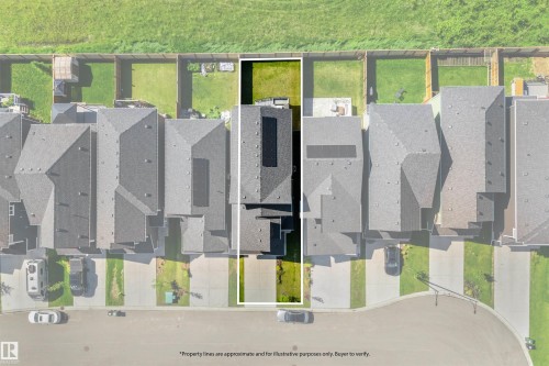 Aerial view showcasing a residential property with a dark shingle roof and a green lawn - 19 Sturtz Place, Leduc, AB 