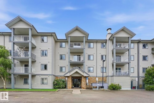 Multistory apartment building with light-colored siding - 426 3425 19 Street, Edmonton, AB 
