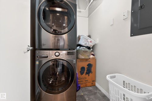 Stacked washer and dryer unit with a dark gray finish - 226 4304 139 Avenue, Edmonton, AB 