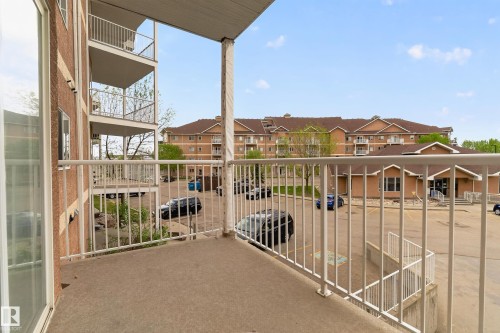 Private balcony with concrete flooring and white metal railings - 226 4304 139 Avenue, Edmonton, AB 