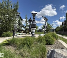Artistic outdoor installations featuring striped and polka-dotted pillars - 