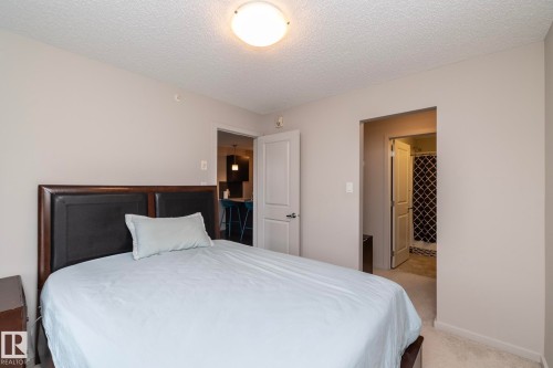 Bedroom with neutral wall color and carpet flooring - 431 344 Windermere Road, Edmonton, AB - Indoor Photo Showing Bedroom