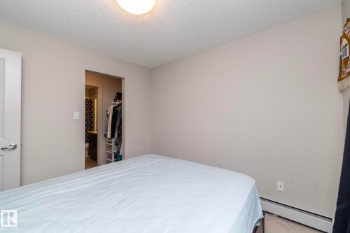 Neutral tone walls with carpet flooring - 431 344 Windermere Road, Edmonton, AB - Indoor Photo Showing Bedroom