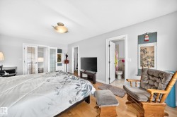 Light wood-finish flooring complements the neutral wall color in this room - 