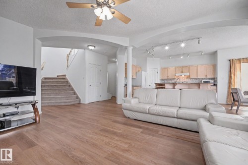 Expansive living area with wood-finish flooring - 262 Dunvegan Road, Edmonton, AB 