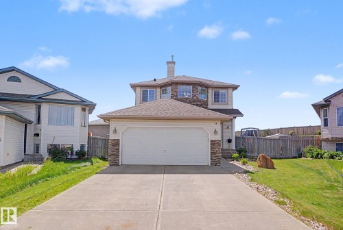 Two-story residence featuring a two-car garage with a concrete driveway - 262 Dunvegan Road, Edmonton, AB 