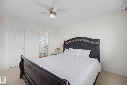 Bedroom featuring light-toned walls and carpeted flooring - 262 Dunvegan Road, Edmonton, AB 