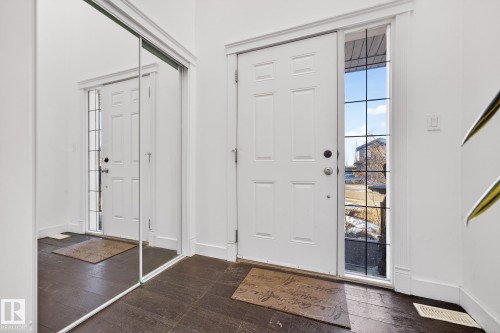Entryway with dark wood-style floors - 1660 Malone Way, Edmonton, AB 