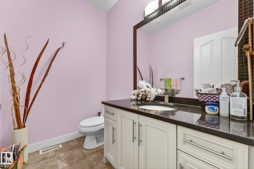 Bathroom featuring toilet and vanity - 1660 Malone Way, Edmonton, AB 