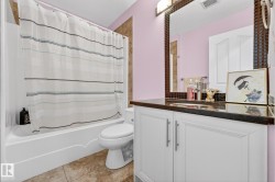 Bathroom with vanity and shower / bath combination with curtain - 