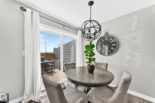 Sliding glass door opening to an outdoor deck - 93 Richmond Link, Fort Saskatchewan, AB 