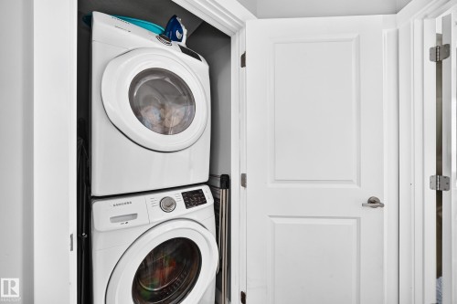 Stacked washer and dryer units within a dedicated closet - 93 Richmond Link, Fort Saskatchewan, AB 