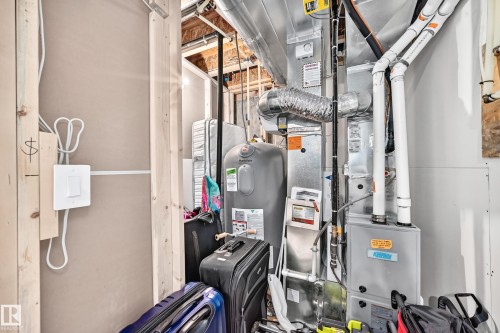 Utility area featuring a water heater and furnace system - 93 Richmond Link, Fort Saskatchewan, AB 
