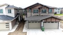 Contemporary home with a multi-textured facade featuring horizontal siding and shake shingles - 3708 40 Ave, Beaumont, AB 