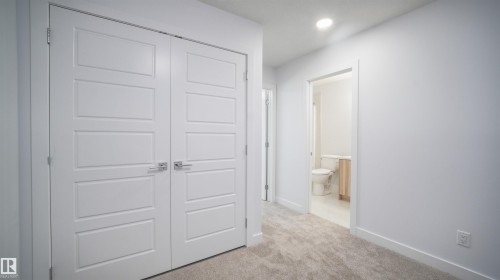 Double panel doors with chrome hardware - 3708 40 Ave, Beaumont, AB 