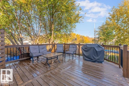 Spacious outdoor deck featuring wood flooring and brown railings - 1112 13 Avenue, Cold Lake, AB - Outdoor With Deck Patio Veranda With Exterior