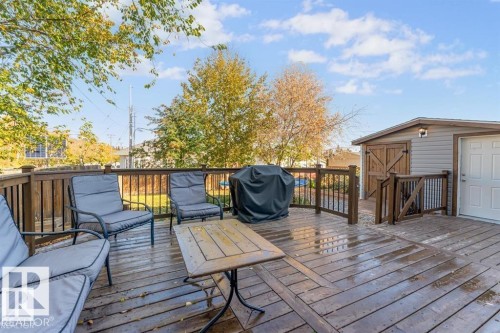 Spacious wood deck featuring railings, a privacy fence, and a multi-level design - 1112 13 Avenue, Cold Lake, AB - Outdoor With Deck Patio Veranda With Exterior