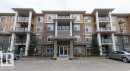 Modern multi-story building featuring stacked stone and horizontal siding - #141 11505 Ellerslie Rd, Edmonton, AB 