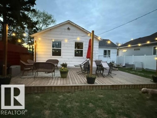 Spacious outdoor deck with wood-finish planks - 4917 45 Avenue, Vegreville, AB - Outdoor With Deck Patio Veranda With Exterior