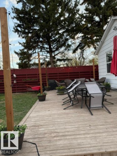 Spacious outdoor deck with natural wood planks - 4917 45 Avenue, Vegreville, AB - Outdoor