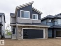 Contemporary two-story residence featuring a stone and siding facade - 6308 65 Avenue, Beaumont, AB 
