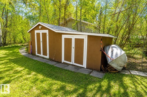 Freestanding shed with a gabled roof and brown siding - 27 Point Drive, Rural St. Paul County, AB - Outdoor