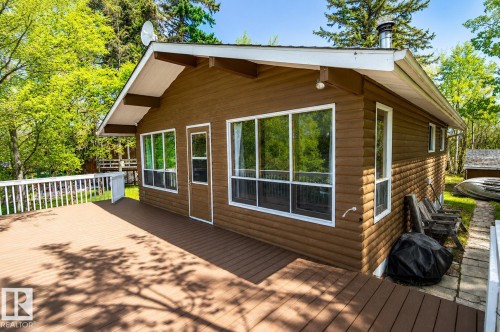 Spacious exterior deck crafted from composite materials, featuring a white railing system - 27 Point Drive, Rural St. Paul County, AB - Outdoor With Deck Patio Veranda With Exterior