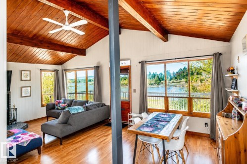 Vaulted wood-paneled ceiling with exposed beams - 27 Point Drive, Rural St. Paul County, AB - Indoor Photo Showing Living Room