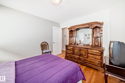 Wood-finish flooring complements light-toned walls - 168 Kulawy Drive N, Edmonton, AB 