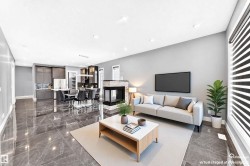 Open-concept living area featuring large format gray marble-look tile flooring, recessed lighting, a modern fireplace with a light stone surround, and floor-to-ceiling windows with horizontal blinds - 