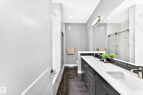 Dual vanity with integrated sinks and white countertops - 1781 Melrose Crescent, Edmonton, AB 