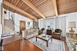 Vaulted wood-paneled ceilings with exposed beams - 
