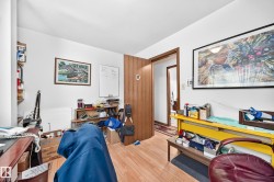 Room featuring light wood-finish flooring and white walls - 