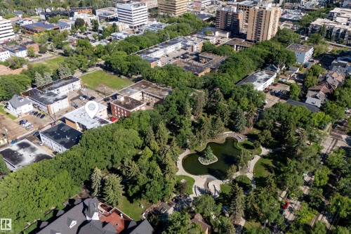 Aerial perspective showcasing a centrally located property amidst a densely treed urban environment - 6 10230 122 Street Nw, Edmonton, AB 