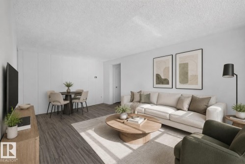 Open-concept living space with wood-finish flooring, white walls, and a textured ceiling - 6 10230 122 Street Nw, Edmonton, AB 