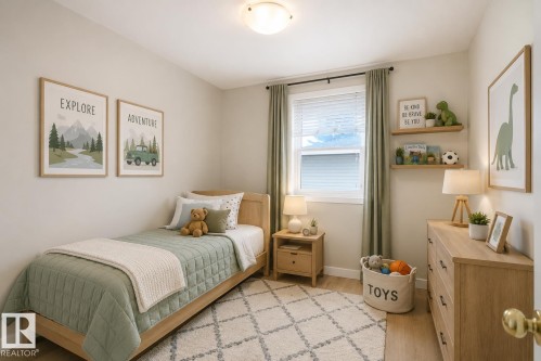 Light-filled bedroom featuring light wood-finish flooring - 9607 75 Street, Edmonton, AB 