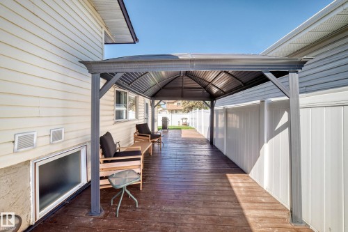 Expansive wood-finish deck featuring a permanent metal gazebo structure - 11708 138 Avenue Nw, Edmonton, AB 