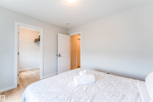 Bright interior space featuring light wood-finish flooring - 8426 228A Street Nw, Edmonton, AB - Indoor Photo Showing Bedroom