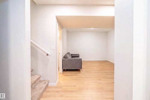Spacious room with light wood-finish flooring - 8426 228A Street Nw, Edmonton, AB - Indoor Photo Showing Other Room
