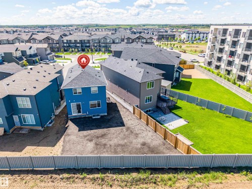 Two-story residence with blue siding and a dark shingle roof - 8426 228A Street Nw, Edmonton, AB - Outdoor