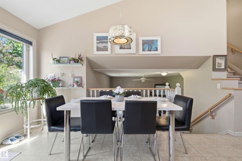 Vaulted dining area featuring a contemporary pendant light fixture - 11715 11B Avenue, Edmonton, AB 