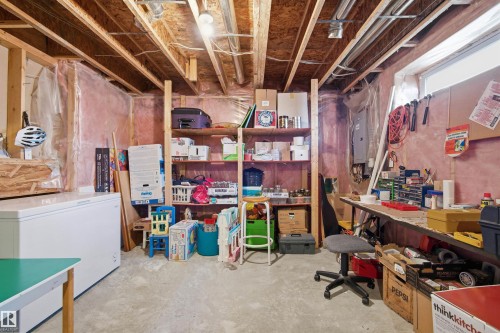Unfinished basement with exposed ceiling joists and concrete flooring - 11715 11B Avenue, Edmonton, AB 