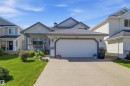 Contemporary single-family residence featuring a double-car garage and a concrete driveway - 11715 11B Avenue, Edmonton, AB 